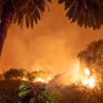 Firefighters battle the Eaton fire as its burns in Sierra Madre, east side of Los Angeles, California, Wednesday, Jan. 8, 2025.