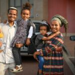 Portrait of an Ethiopian family posing cheerfully for the camera.Israel Ashkelon september 2022