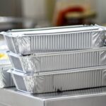 Take away  food in foil boxes in Chinese restaurant kitchen
Food ready for home delivery