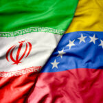 big waving realistic national colorful flag of iran and national flag of venezuela . macro
