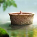 Baby child Moses in a basket floating on a river. Biblical theme concept.