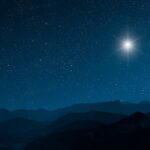 a Christmas star shines at night over the mountains of Bethlehem